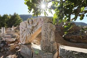 Stone carving of the goddess Nike in Ephesus Ancient City, Izmir, Turkey photo