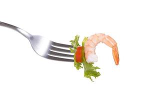 Mixed salad on fork isolated on white background photo