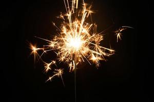 New year party sparkler on black background photo