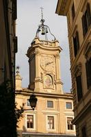 Clock Tower over a Building in Rome, Italy photo