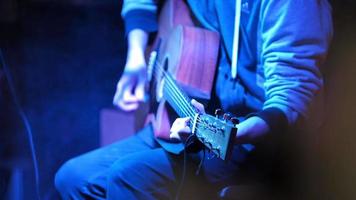 Musician in night club guitarist plays acoustic guitar video