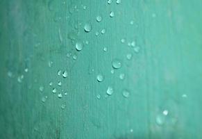 raindrop on the wall are shiny green due to the reflection photo