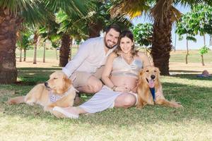 Pregnant couple with dogs photo