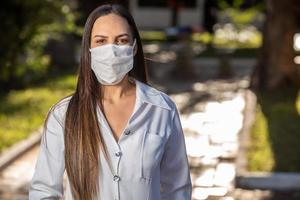 Brazilian doctor woman in a white coat. photo