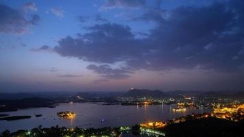 Evening view of Udaipur city skyline and lake Pichola time lapse 4K footage seen from Udaipur view point. video