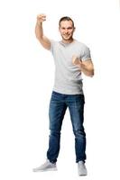 Handsome man clenching his fists. Cheering gesture. photo