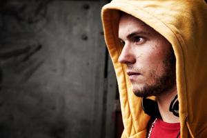 Young man portrait on graffiti grunge wall photo