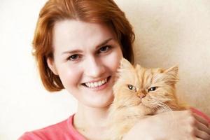 Young woman with Persian cat portrait photo
