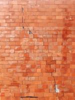 cracked wall brick wall texture, old wall with red brick background with old dirty and vintage style pattern photo