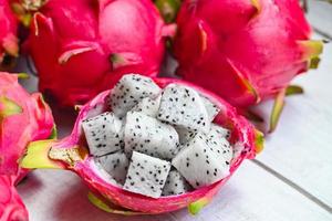 fresh white dragon fruit tropical in the asian thailand healthy fruit concept, dragon fruit slice on fruit peel with pitahaya background photo