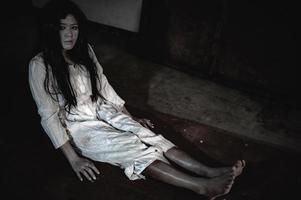 Portrait of asian woman make up ghost,Scary horror scene for background,Halloween festival concept,Ghost movies poster photo