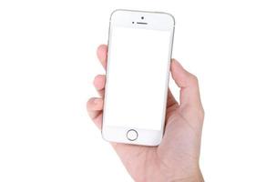 mujer mano sosteniendo teléfono móvil aislado en blanco foto