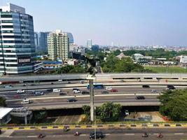 Jakarta, Indonesia, 2022 - Beautiful aerial view, traffic and office buildings on Jalan Statue Pancoran. photo