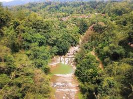 Beautiful aerial view, Small river in tropical forest, West Java - Indonesia. photo