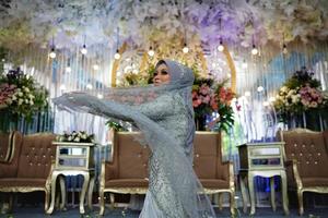 Bandung, West Java, Indonesia, 2021- Muslim bride in Indonesian traditional wedding photo