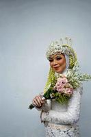 Bandung, West Java, Indonesia, 2021- Muslim bride in Indonesian traditional wedding. photo