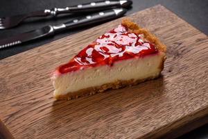 Delicious strawberry tart on concrete background, top view, copy space photo
