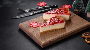 Delicious christmas strawberry tart on concrete background, top view, copy space photo