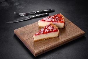 Delicious strawberry tart on concrete background, top view, copy space photo