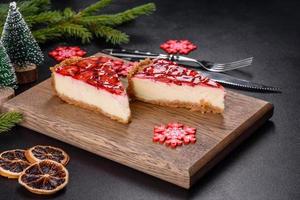 Delicious christmas strawberry tart on concrete background, top view, copy space photo