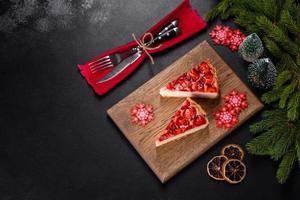 Delicious christmas strawberry tart on concrete background, top view, copy space photo