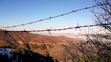 A photo of barbed wire in nature