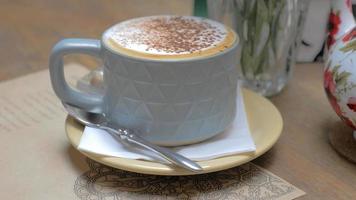 A close-up on a cup of cream coffee photo