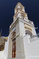 Steeple of a Church in Symi Island, Greece photo