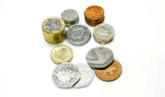 Top view stack of British currency coins isolate on white background. photo