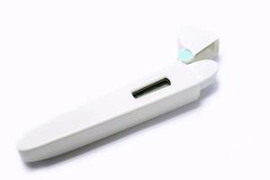 Medical thermometer in casing on white background. photo