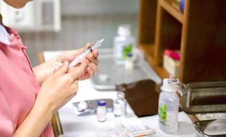 Asian nurses are preparing to syringe for injection patient in a hospital. photo