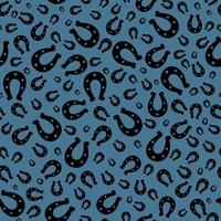 Lucky horseshoes, silhouettes, seamless vector pattern on blue background