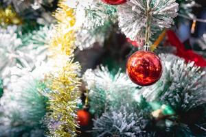 Beautiful decorated christmas tree with christmas ball. Holiday background and happy new year. photo