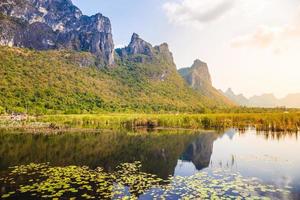 Beautiful landscape of mountain with grass field and blue sky range background in Khao Sam Roi Yot National Park, Kui Buri District, Prachuap Khiri Khan, Thailand photo