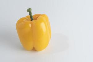 Fresh yellow sweet pepper Placed on a white background photo