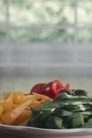 Yellow, red and green sweet peppers photo