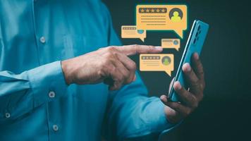 young businessman using a mobile phone To express opinions after using the service through online channels, photo