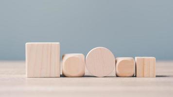 Wooden blocks of various sizes and shapes. arranged in an orderly row photo