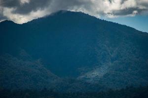 Beautiful morning view in Indonesia. panorama of high mountain range on a sunny day photo