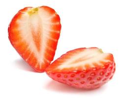 Strawberry. Cut strawberries into pieces. Strawberry slices flying in the air. Fresh natural strawberry isolated . photo