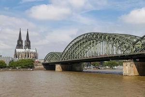 Hohenzollern Bridge and Cologne Cathedral in Cologne, Germany photo