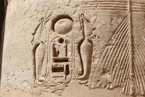 Egyptian Hieroglyphs in Medinet Habu Temple, Luxor, Egypt photo