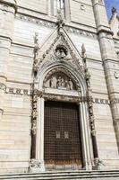 Facade of Naples Cathedral in Naples, Italy photo