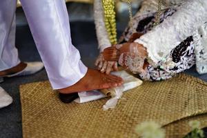 Bandung, West Java, Indonesia, 2021- Groom and bride in Indonesian traditional wedding photo