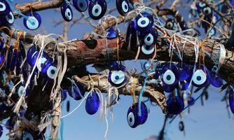 Evil Eye Beads Tree in Pigeons Valley, Cappadocia, Nevsehir, Turkey photo