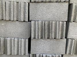 collection of cement block or brick lined up in warehouse photo