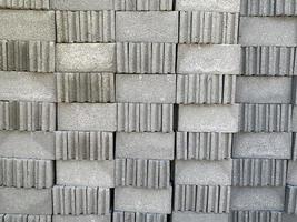 collection of cement block or brick lined up in warehouse photo