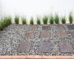 Small garden with the brick path. photo