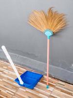 New broom and the plastic dustpan. photo