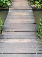 Small plank bridge over the canal. photo